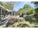 Lush backyard with a patio, outdoor seating, and well-manicured lawn, perfect for relaxation and entertaining at 521 Pelzer Dr, Mount Pleasant, SC 29464