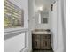 Bright bathroom featuring a patterned floor, vanity, and a window at 521 Pelzer Dr, Mount Pleasant, SC 29464