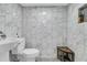 Modern bathroom with white marble tile, a sleek toilet, and a wooden stool at 521 Pelzer Dr, Mount Pleasant, SC 29464