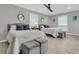 Bright bedroom with two beds, gray ottomans, large windows providing plenty of natural light at 521 Pelzer Dr, Mount Pleasant, SC 29464