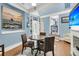 Inviting dining room featuring a guitar, a wet bar, and an open doorway to the kitchen at 521 Pelzer Dr, Mount Pleasant, SC 29464