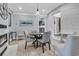 Elegant dining room with a modern light fixture, fireplace, and comfortable seating at 521 Pelzer Dr, Mount Pleasant, SC 29464
