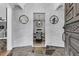 Elegant foyer featuring stone floors, brick walls, mirrors, and a view into the dining room at 521 Pelzer Dr, Mount Pleasant, SC 29464
