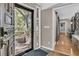 Charming foyer view, with hardwood floors, an elegant front door, and a hallway beyond at 521 Pelzer Dr, Mount Pleasant, SC 29464