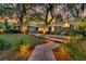 Beautiful brick home with a stone walkway, manicured landscaping, and landscape lighting at 521 Pelzer Dr, Mount Pleasant, SC 29464