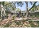 Brick home featuring mature trees, beautiful landscaping and a stylish modern front door at 521 Pelzer Dr, Mount Pleasant, SC 29464