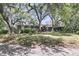 Beautiful brick home featuring mature trees, a well-manicured lawn and charming curb appeal at 521 Pelzer Dr, Mount Pleasant, SC 29464