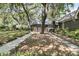 Beautiful home exterior with a brick facade and an abundance of mature trees at 521 Pelzer Dr, Mount Pleasant, SC 29464