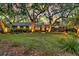 Charming brick home with a sprawling front lawn, mature trees, and inviting curb appeal at 521 Pelzer Dr, Mount Pleasant, SC 29464
