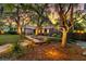 Beautiful brick home with well-manicured landscaping and a stone walkway leading to the entrance at 521 Pelzer Dr, Mount Pleasant, SC 29464