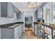Bright kitchen features granite countertops and gray cabinetry with an eat-in bar at 521 Pelzer Dr, Mount Pleasant, SC 29464