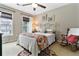Cozy bedroom with floral bedding, rocking chair, and natural light at 5451 Kings River Dr, North Charleston, SC 29420