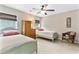 Bright bedroom with two twin beds, wood dresser, and woven chair at 5451 Kings River Dr, North Charleston, SC 29420