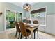 Dining area with large windows and access to the screened porch at 5451 Kings River Dr, North Charleston, SC 29420