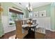 Bright dining area featuring wainscoting, natural lighting, and stylish decor at 5451 Kings River Dr, North Charleston, SC 29420
