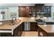 Beautiful kitchen with granite countertops, stainless steel appliances, and dark wood cabinets at 5451 Kings River Dr, North Charleston, SC 29420