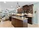 Spacious kitchen with an island, stainless steel appliances, and dark wood cabinets at 5451 Kings River Dr, North Charleston, SC 29420