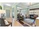 Inviting living room space with tile and hardwood floors, open to a dining area with lots of natural light at 5451 Kings River Dr, North Charleston, SC 29420