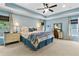 Spacious main bedroom with tray ceiling, lamps, and desk area at 5451 Kings River Dr, North Charleston, SC 29420