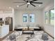 Bright living room featuring modern decor, a stylish area rug, and comfortable seating at 5841 Kirkwood Ave, North Charleston, SC 29406