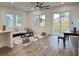 Open-concept living area with wood floors, plenty of natural light, and a seamless transition to the outdoors at 5841 Kirkwood Ave, North Charleston, SC 29406