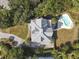 Aerial view of the home showcasing the roof and surrounding landscape with a pool at 6 Intracoastal Ct, Isle of Palms, SC 29451