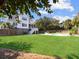 Large backyard with a pool, green grass, and a well-maintained lawn at 6 Intracoastal Ct, Isle of Palms, SC 29451