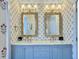 Charming bathroom with a double vanity, decorative wallpaper, and ample counter space at 6 Intracoastal Ct, Isle of Palms, SC 29451