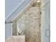 Modern bathroom with a glass-enclosed shower, marble tiling, and sleek fixtures at 6 Intracoastal Ct, Isle of Palms, SC 29451