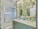 Stylish bathroom with double vanity, marble countertop, and a glass-enclosed shower at 6 Intracoastal Ct, Isle of Palms, SC 29451