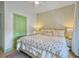 Tranquil bedroom featuring plush bed, stylish lamps, and lots of natural light at 6 Intracoastal Ct, Isle of Palms, SC 29451