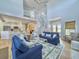 Bright, open-concept living room with comfortable seating and staircase, perfect for entertaining guests at 6 Intracoastal Ct, Isle of Palms, SC 29451
