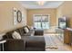 Inviting living room features sectional sofa, decorative wall decor, TV, and natural light at 6 Intracoastal Ct, Isle of Palms, SC 29451