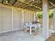 Outdoor dining area with seating and lights beneath a deck at 6 Intracoastal Ct, Isle of Palms, SC 29451
