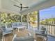 Relaxing screened porch with comfortable seating and scenic views of lush greenery at 6 Intracoastal Ct, Isle of Palms, SC 29451