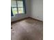 Inviting bedroom with soft carpet, a bright window, and neutral walls, creating a serene retreat at 609 Coral St, Mount Pleasant, SC 29464