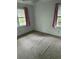 Cozy bedroom featuring soft carpet, two windows, and neutral decor, a versatile space to make your own at 609 Coral St, Mount Pleasant, SC 29464
