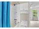 Bathroom featuring a shower/tub combo and a toilet with storage cabinets at 6260 Brandt St # 4-D, North Charleston, SC 29406