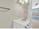 Bright bathroom with a white vanity, mirror, and ample lighting at 6260 Brandt St # 4-D, North Charleston, SC 29406