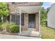 Close-up of a brick townhome entrance with a covered porch at 6260 Brandt St # 4-D, North Charleston, SC 29406