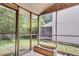 Screened-in porch with an exterior view to a wooded area at 6260 Brandt St # 4-D, North Charleston, SC 29406