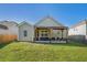 Backyard featuring a covered patio perfect for entertaining, surrounded by green lawn at 632 Grassy Hill Rd, Summerville, SC 29483