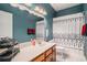 Bathroom with vanity, toilet, modern patterned shower curtain and ample lighting at 632 Grassy Hill Rd, Summerville, SC 29483