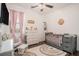 Well-decorated Bedroom with pink accents and furnishings, including a crib and changing table at 632 Grassy Hill Rd, Summerville, SC 29483