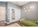 Neutral-toned bedroom featuring hardwood floors and decoratively hung photos at 632 Grassy Hill Rd, Summerville, SC 29483