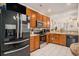 Well-equipped kitchen featuring wood cabinets, stainless steel appliances, and white tile floors at 632 Grassy Hill Rd, Summerville, SC 29483