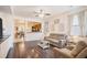 Inviting living room with dark wood floors, neutral walls, comfortable seating, and a view into the kitchen at 632 Grassy Hill Rd, Summerville, SC 29483