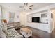 Cozy living room with hardwood floors, comfortable seating, a ceiling fan, and built in entertainment center at 632 Grassy Hill Rd, Summerville, SC 29483