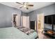 Comfortable main bedroom featuring hardwood floors, neutral walls, and an ensuite bathroom and walk-in closet at 632 Grassy Hill Rd, Summerville, SC 29483