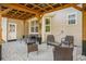 Cozy covered patio featuring outdoor furniture and a pebble border for relaxation at 632 Grassy Hill Rd, Summerville, SC 29483